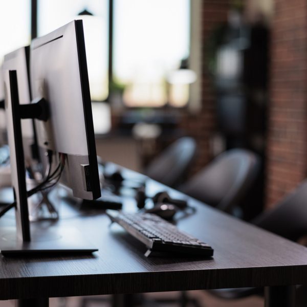 No people at call center helpdesk with multiple monitors in office, customer service and client support telecommunication. Nobody working at telemarketing assistance with helpline contact.